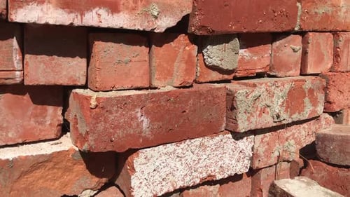 Stack of Rough Red Construction Bricks