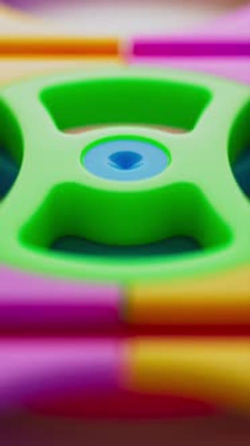 Colorful plastic gears from a kids educational toy set.