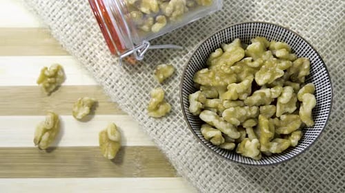 Bowl of Fresh Walnuts on Table