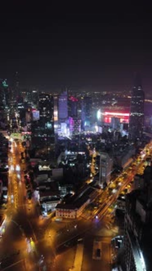 Aerial night view of Ho Chi Minh City, Vietnam Saigon, densely populated area with buildings and cit