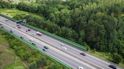 European four lane highway with busy traffic, aerial dolly out