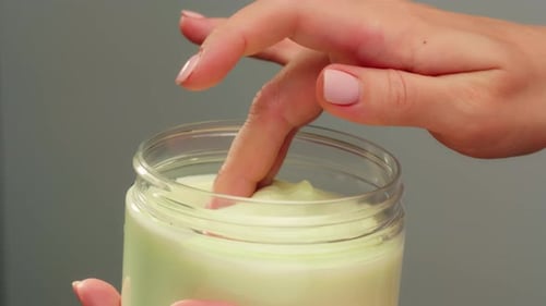 Woman Apply Cream for Hands Skin Closeup of Hands with Exfoliating Cream Demonstrating Effective