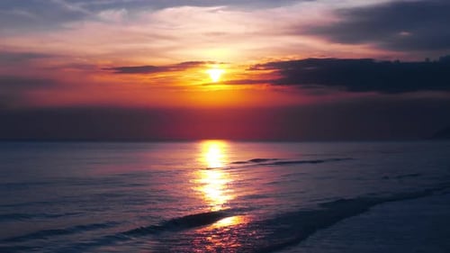 Sunset Reflections Over the Ocean Waves