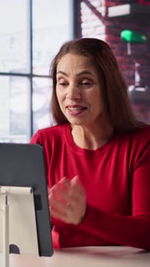 Woman Video Calling on Tablet at Home