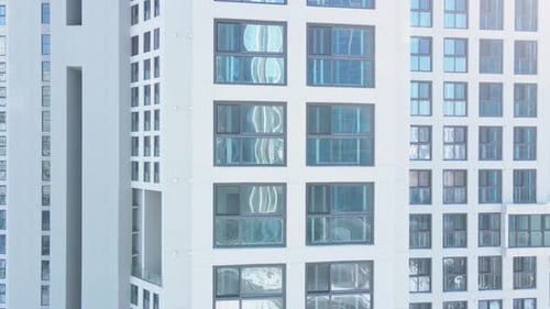 Modern white building of residential complex, urban geometry.