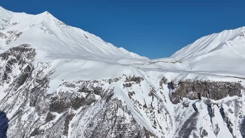 Aerial view of beautiful snowy mountains in Gudauri, Georgia