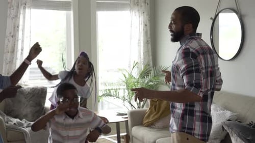 Family Dance Party Fun Together in Living Room
