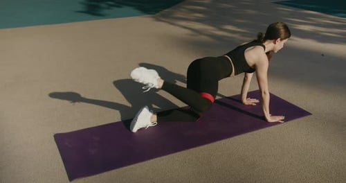 Woman Exercising with Resistance Band Outdoors