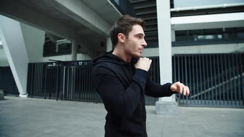 Close Up Man Training Boxing Beats on Workout Outdoor. Young Fighter Training