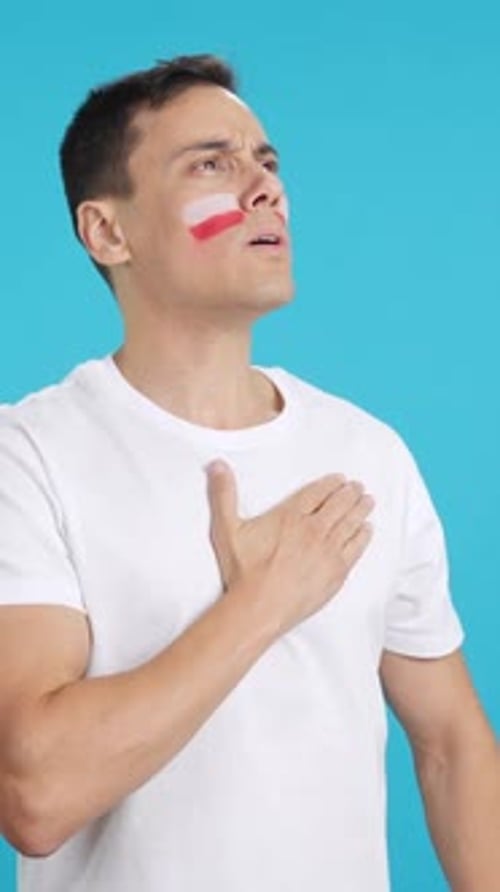 Man Listening to the Poland National Anthem with Solemnity