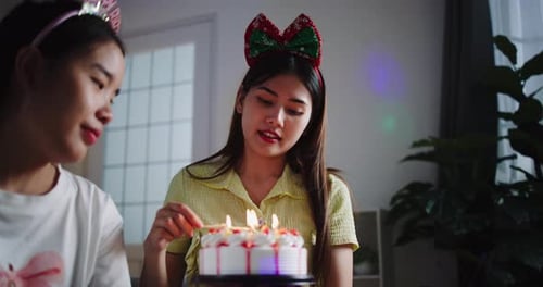 Young Women Celebrating a Birthday at Home