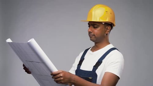 Profession, Construction and Building - Happy Smiling Indian Builder in Helmet With