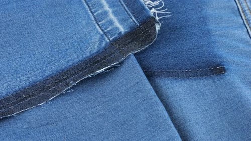 Close-up of Blue Denim Fabric with Stitching Detail