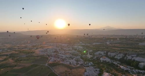 Aerial Cinematic Drone View of Colorful Hot Air Balloon Flying Over Cappadocia