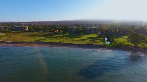 Paradise gateway resort in Hawaii coastline surrounded by green vegetation and palm trees, located n
