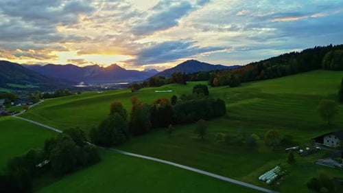 Dramatic Sunrise Over Fields And Mountains In Autumn. aerial shot