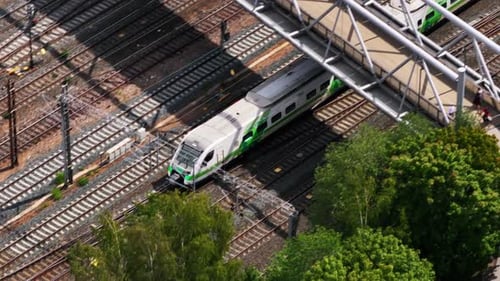 High Angle View of Finnish Pendolino on Multitrack Railway Line Approaching Station Slowly Moving