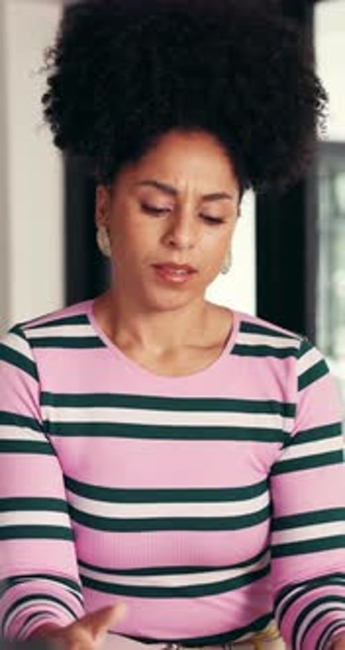 Woman Experiencing Headache While Looking at Tablet