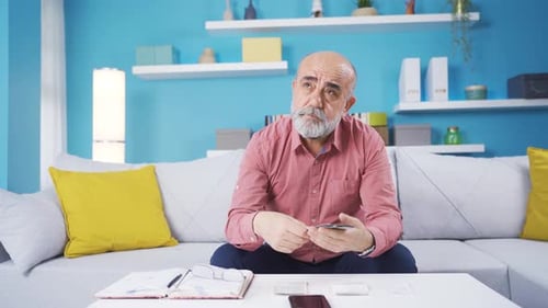 Adult Counting Money Indoors