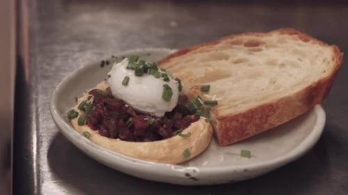 Gourmet Dish with Bread and Topping on Plate