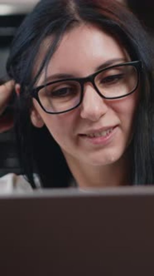Woman Wearing Glasses Working on Laptop