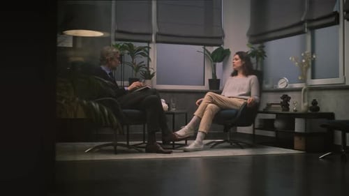 Woman Discussing Issues with Therapist in Office