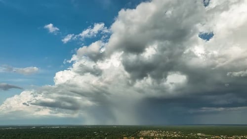 Dark Stormy Clouds Forming on Gloomy Sky Before Heavy Rainfall Over Suburban Town Area