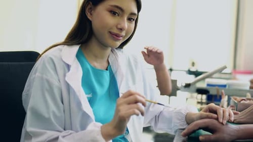 Concentrated prosthodontist panting bionic silicon hand prosthesis for the patient