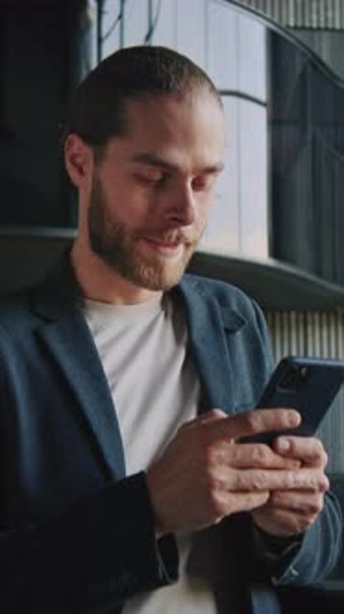 Portrait Business Man Using Phone Feel Happy Indoors in Business Centre On the Background Modern