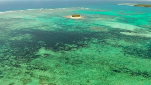 Tropical Guyam Island with a Sandy Beach and Tourists