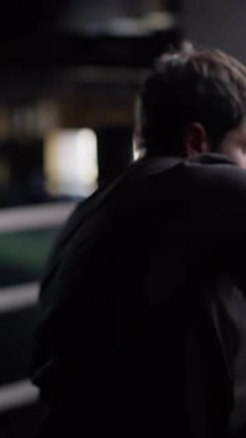 The Man Makes a Couple of Strong Punches and Turns His Gaze Towards the Camera