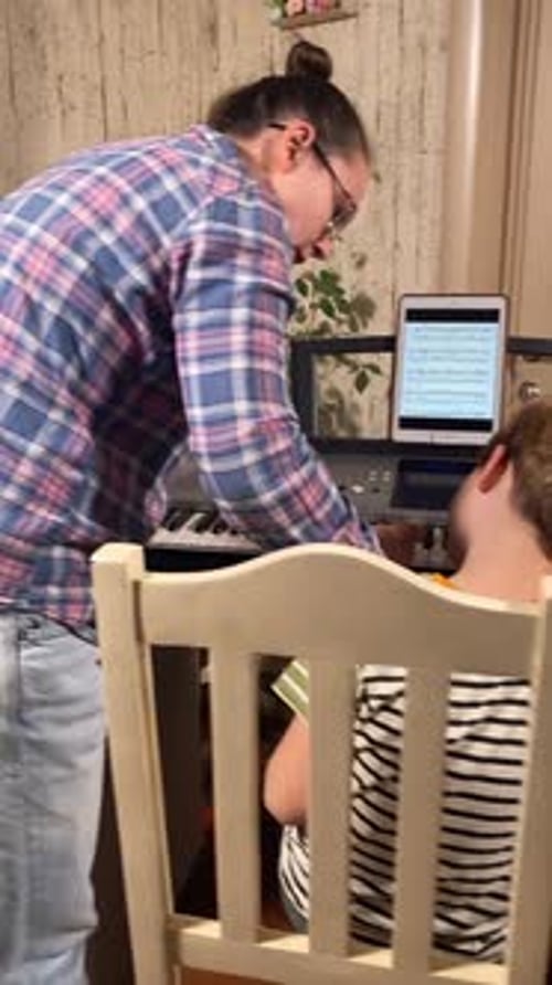 Boy Learning Piano With an Instructor at Home