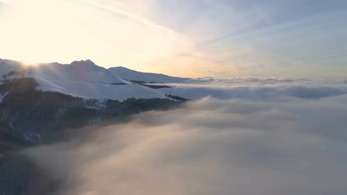 sunrise over the clouds in winter period above balkan mountain