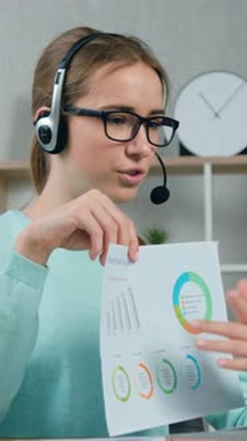 Front View of Pleasant Smart Creative 20Aged Girl in Glasses Which Wears Headphones Passes the Exam