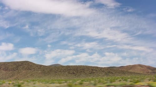 California Circa-2020. Stabilized Driving of Clouds Over Desert Landscape. With