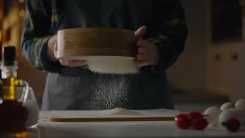 Chef Sifting Flour in Cozy Kitchen Setting
