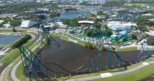 Excited Fun of Enjoying Thrilling Rollercoaster at Amusement Park in Orlando Florida USA Tourist
