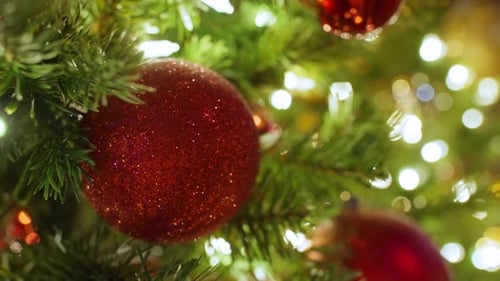 Festive Christmas tree with red ornaments and lights