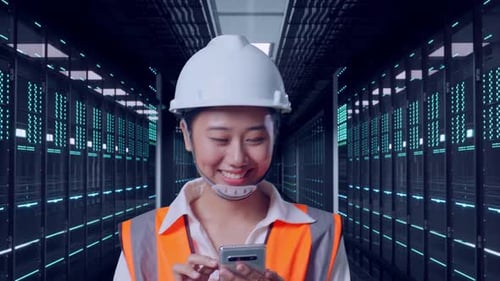 Asian Female Use Smartphone While Walking in Data Center