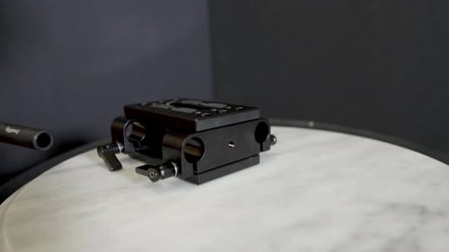 Placing a rod into the assembly.