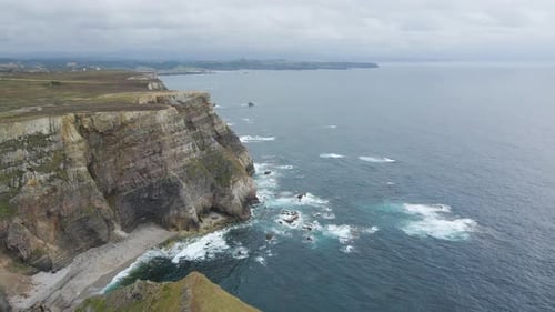 Aerial view of Asturias coastline. Drone shot of sea, cliff, rocks and the Atlantic ocean in Spain.