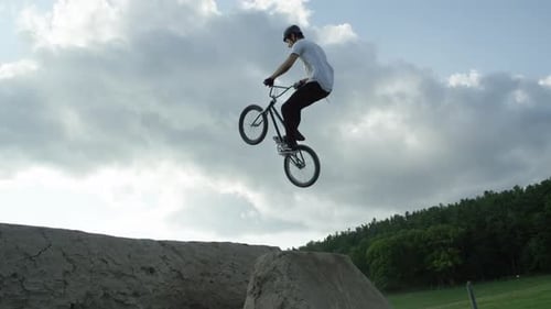 Bicycle Jump on Rural Dirt Ramp