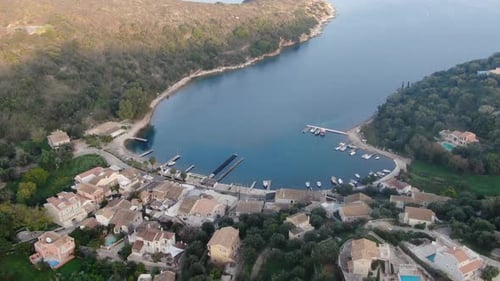 Breathtaking aerial drone footage flying over the idyllic and secluded Kouloura Bay in Corfu, Greece