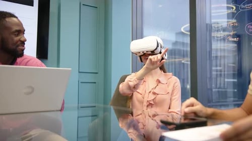 Using VR headset, woman interacting in modern office meeting with diverse colleagues