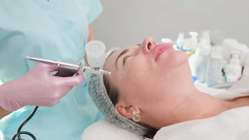 Woman Receives Serene Facial Treatment at Clinic
