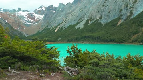 Aerial View on Emerald Lake in the Andes Mountain Forest in Rainy Day Chile