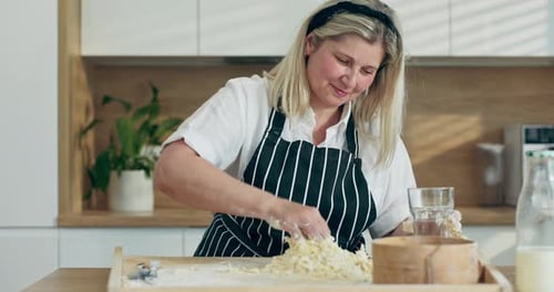 Woman Baking Dough in a Bright Kitchen