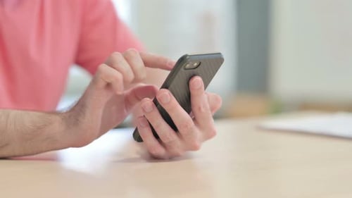 Close up of Male Hand Using Smartphone