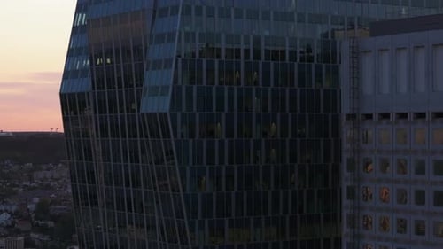 Aerial Ascending Footage of Glass Facade of Modern High Rise Office Tower in La Defense Business