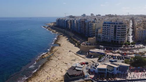 Aerial View of Sliema Seafront in Malta with Apartments and Cafes